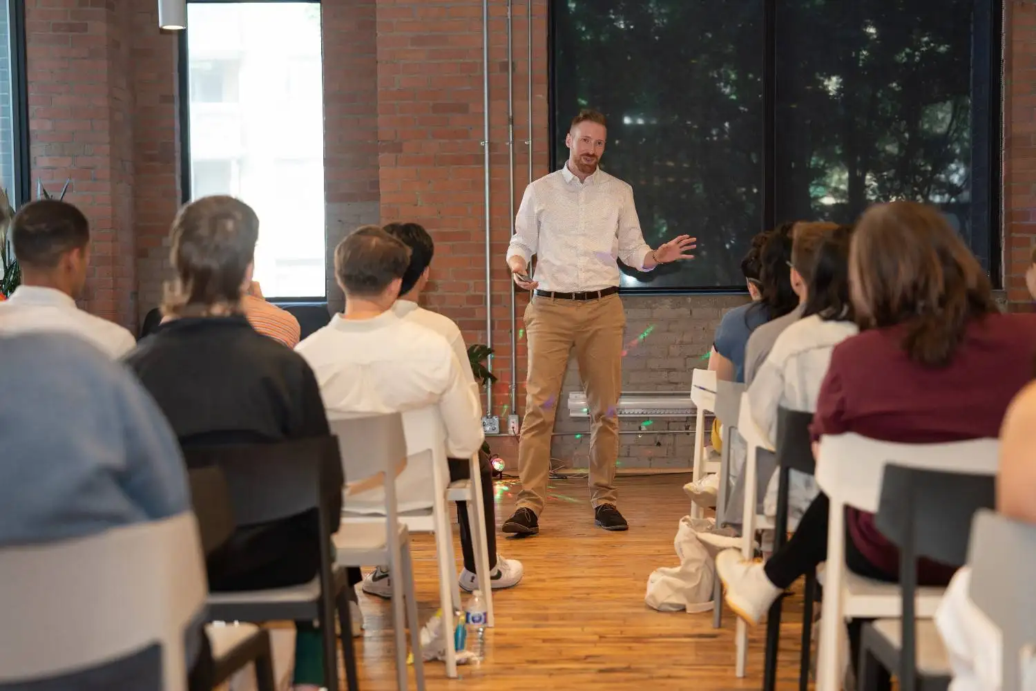 Calan Breckon speaking at Cohere AI event. Photo by: Shay Markowitz