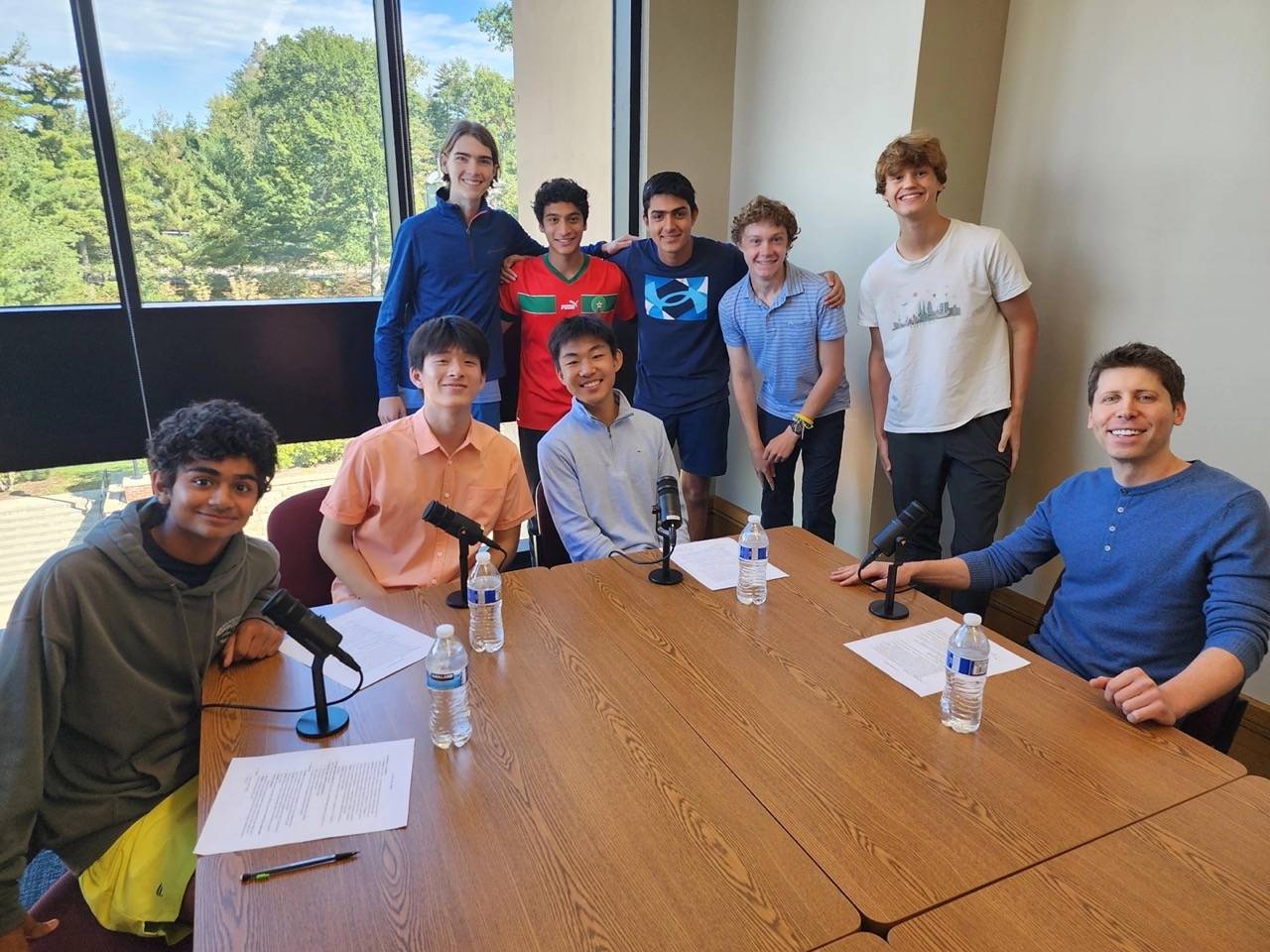 Sam Altman (pictured right) sitting down for a podcast conversation with high school students.